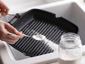 how to clean burnt cast iron grill pan