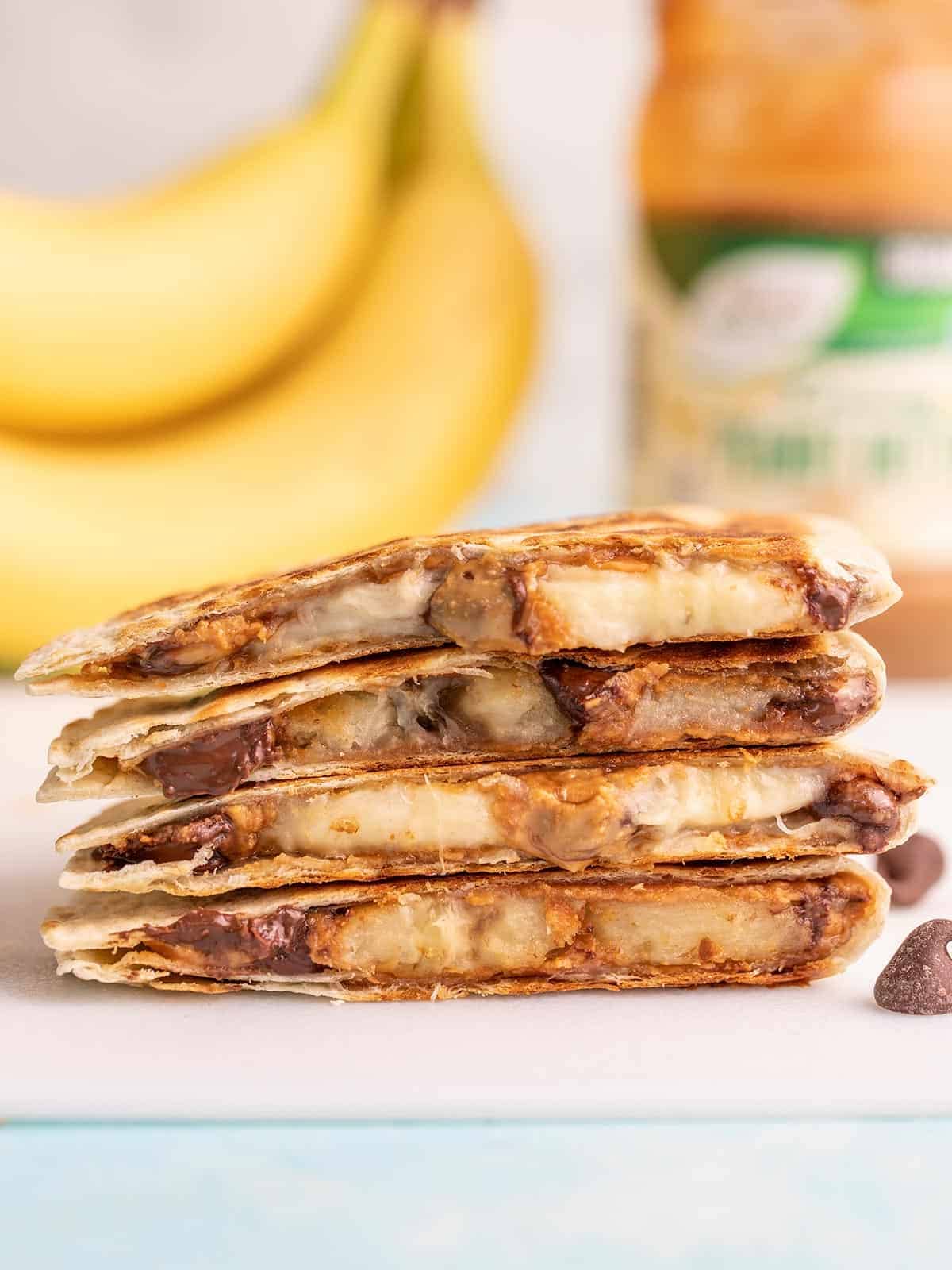 side view of stacked peanut butter banana quesadillas.