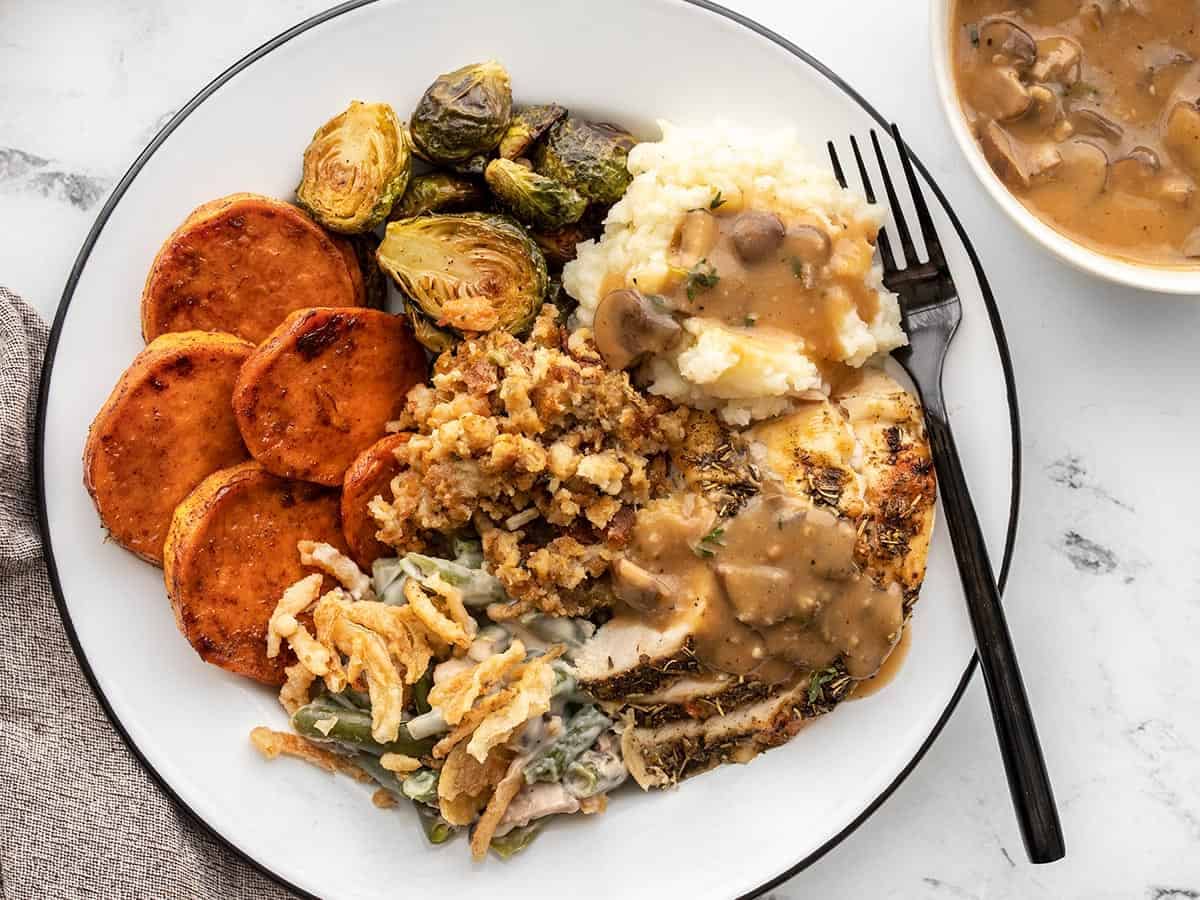 Thanksgiving dinner for two on a plate with a fork