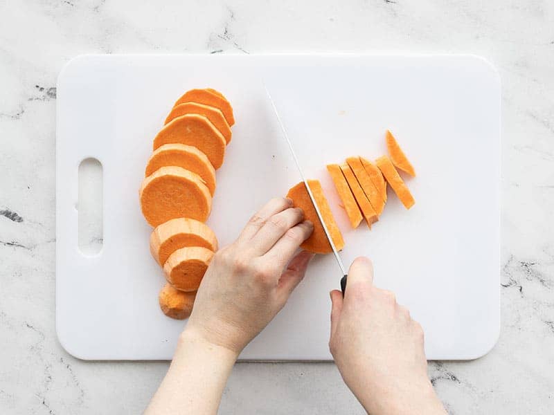 Sweet potato being cut into strips