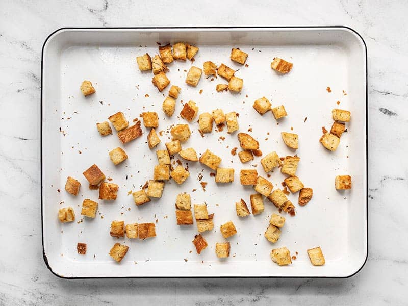 Baked homemade croutons on the baking sheet