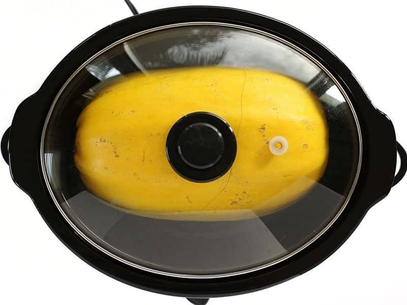Lid on Slow Cooker with spaghetti squash inside