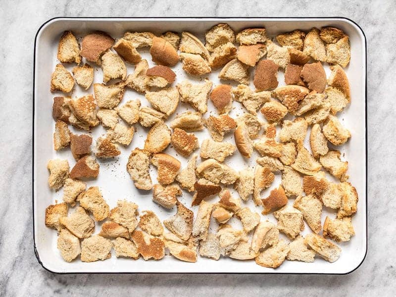 Slightly baked Dried Bread Chunks on the baking sheet