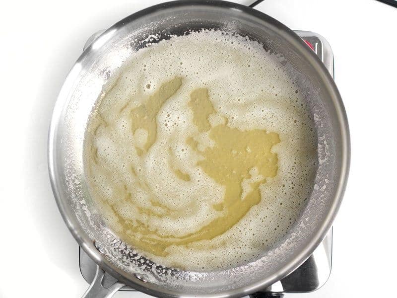 Foamy melted butter in the skillet