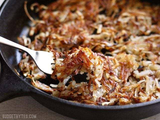 Close up of forkful of Crispy Hash Browns 