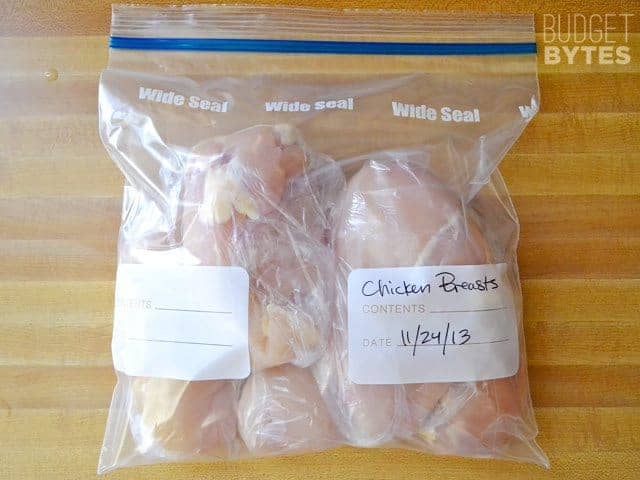 Slide individually wrapped chicken breasts into large zip lock bag and seal 