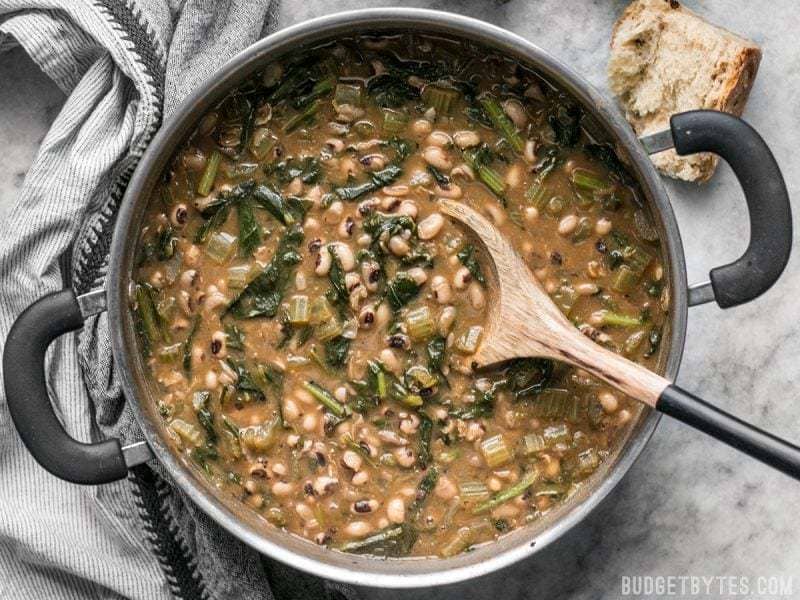 Slow Simmered Black Eyed Peas and Greens is a great cold weather comfort food that is as healthy as it is delicious!