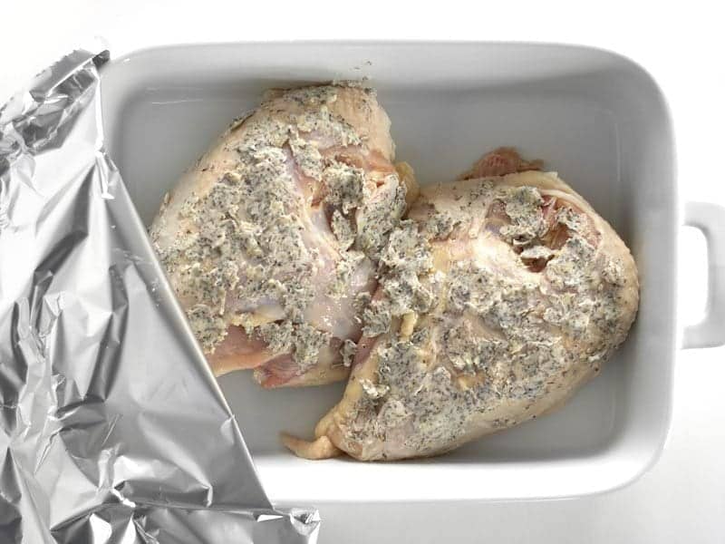 Herb Chicken Breasts in a casserole dish, covered with foil, Ready to Bake