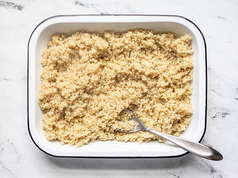 Spread out quinoa in a dish to cool