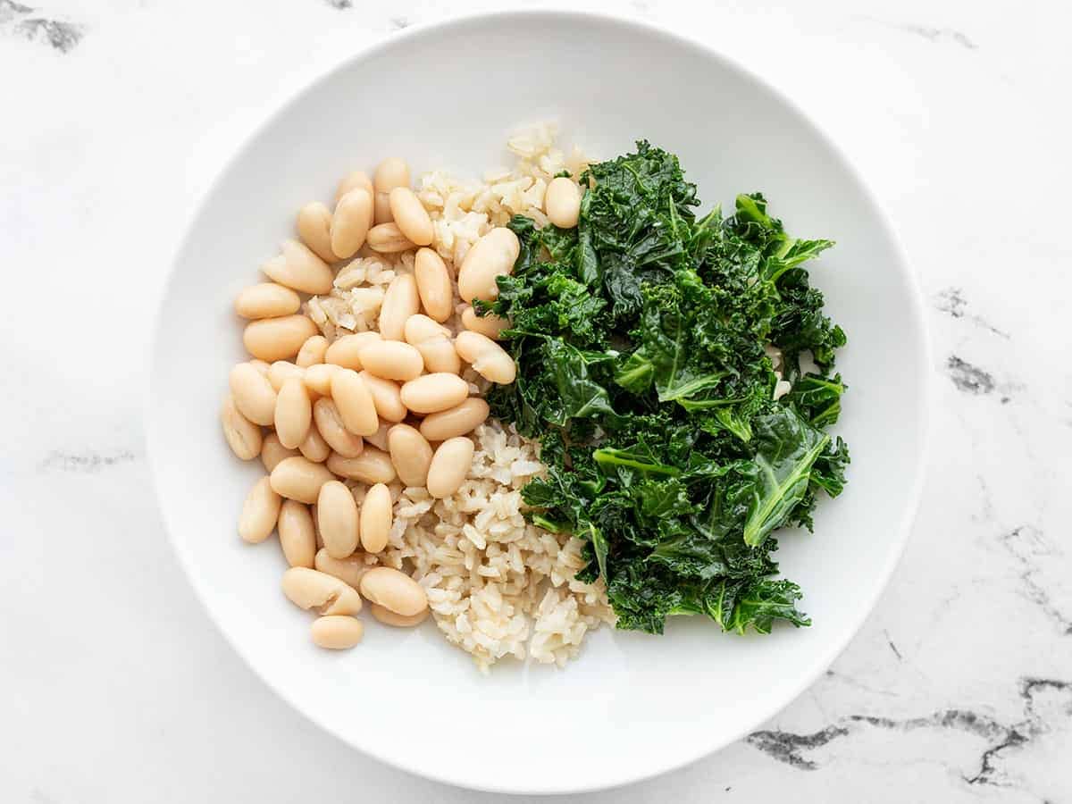 Power bowls base layer of rice, kale, and beans