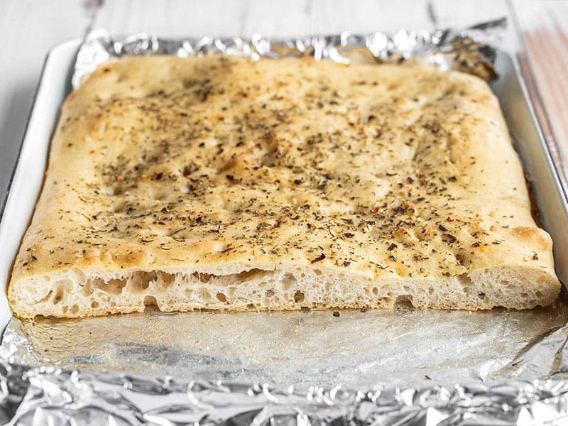 Focaccia on baking sheet, cut open