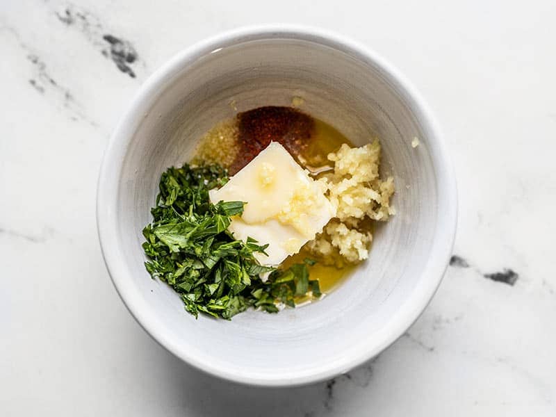 Garlic butter ingredients in a small bowl, unmixed.