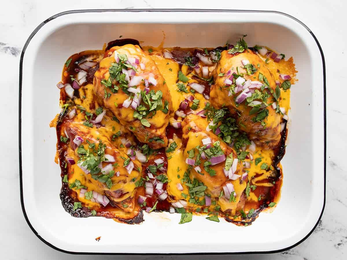 Baked bbq chicken topped with red onion and cilantro