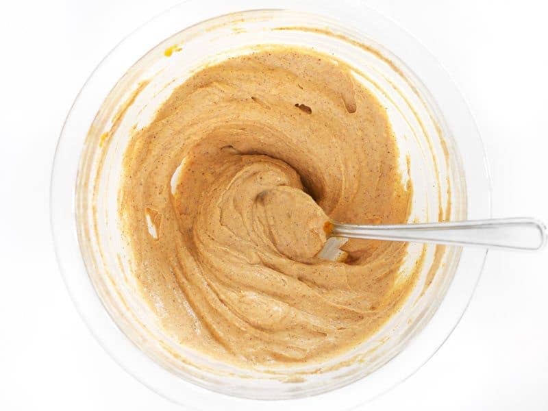 Pumpkin Cream Cheese Spread Mixed in bowl with spoon 