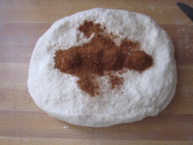 ball of dough with cinnamon on top