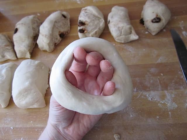 dough stretched out to make bagel shape 