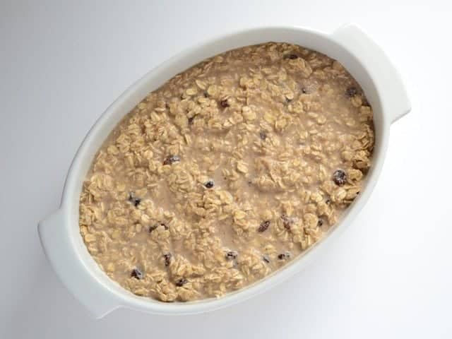 Oat mixture poured into casserole dish, ready to bake