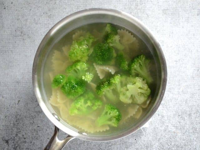 Pasta and broccoli in a sauce pot full of water