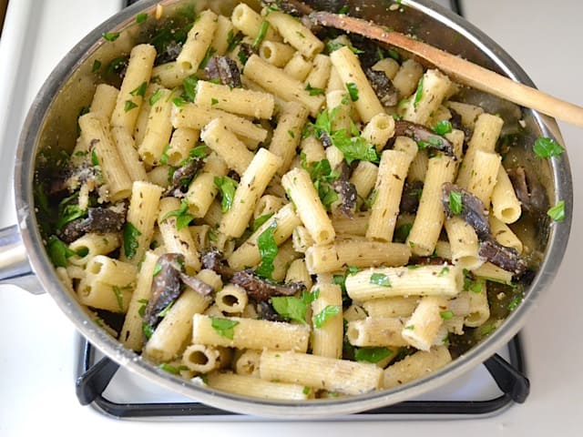 finished pasta in skillet on stove top 