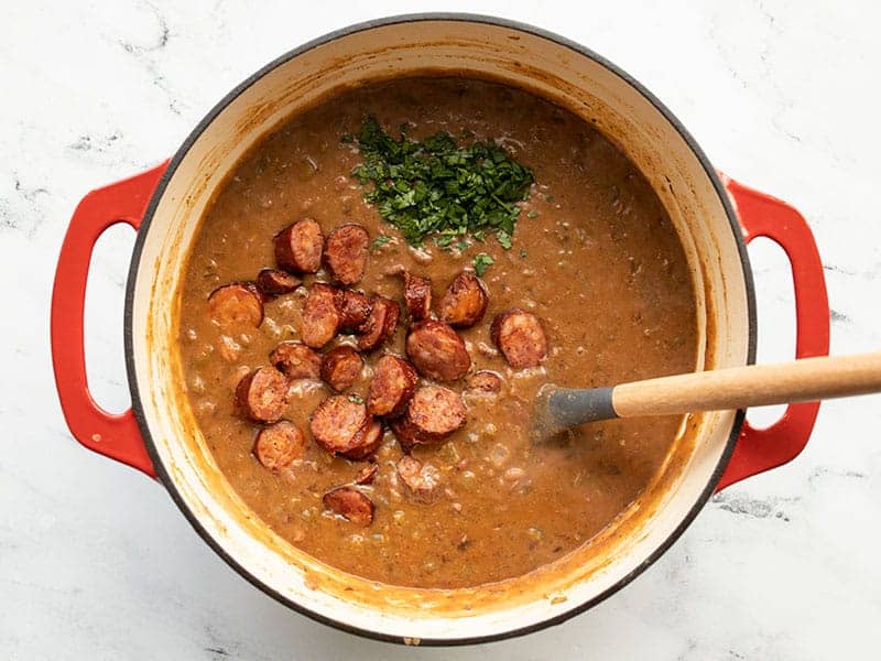 Andouille and parsley added to red beans