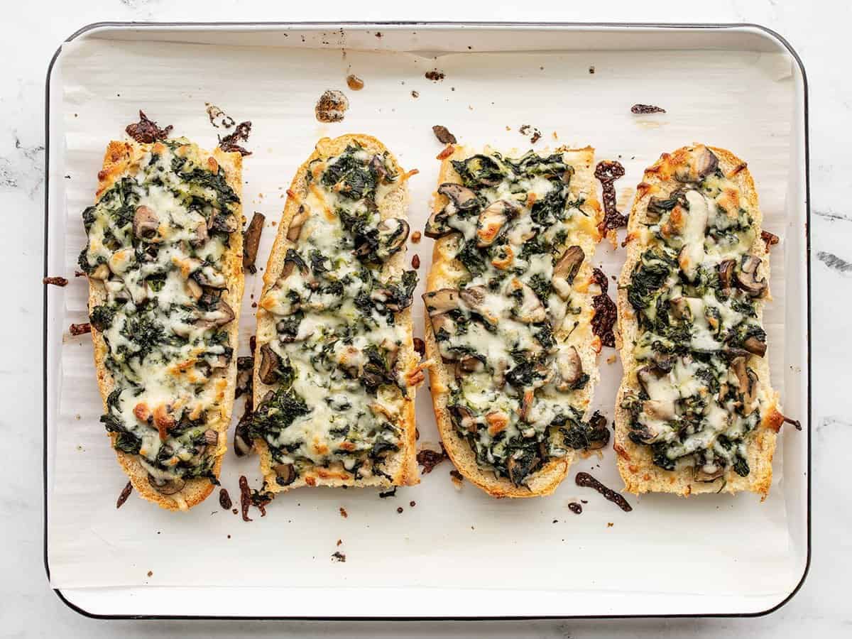 baked spinach mushroom french bread pizzas.