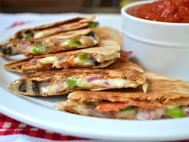 pizzadillas on plate with pizza sauce for dipping