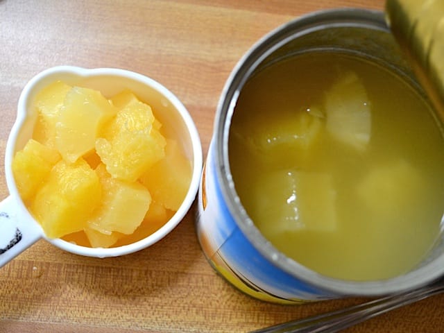 pineapple chunks in measuring cup 