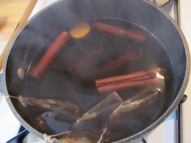 steamy and simmering spiced tea in pot 