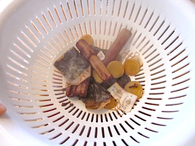 spiced tea drained through strainer 