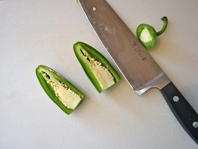 jalapeno cut in half with knife 