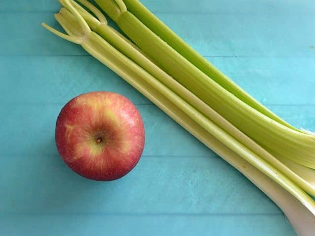 Apple and Celery on cutting board 