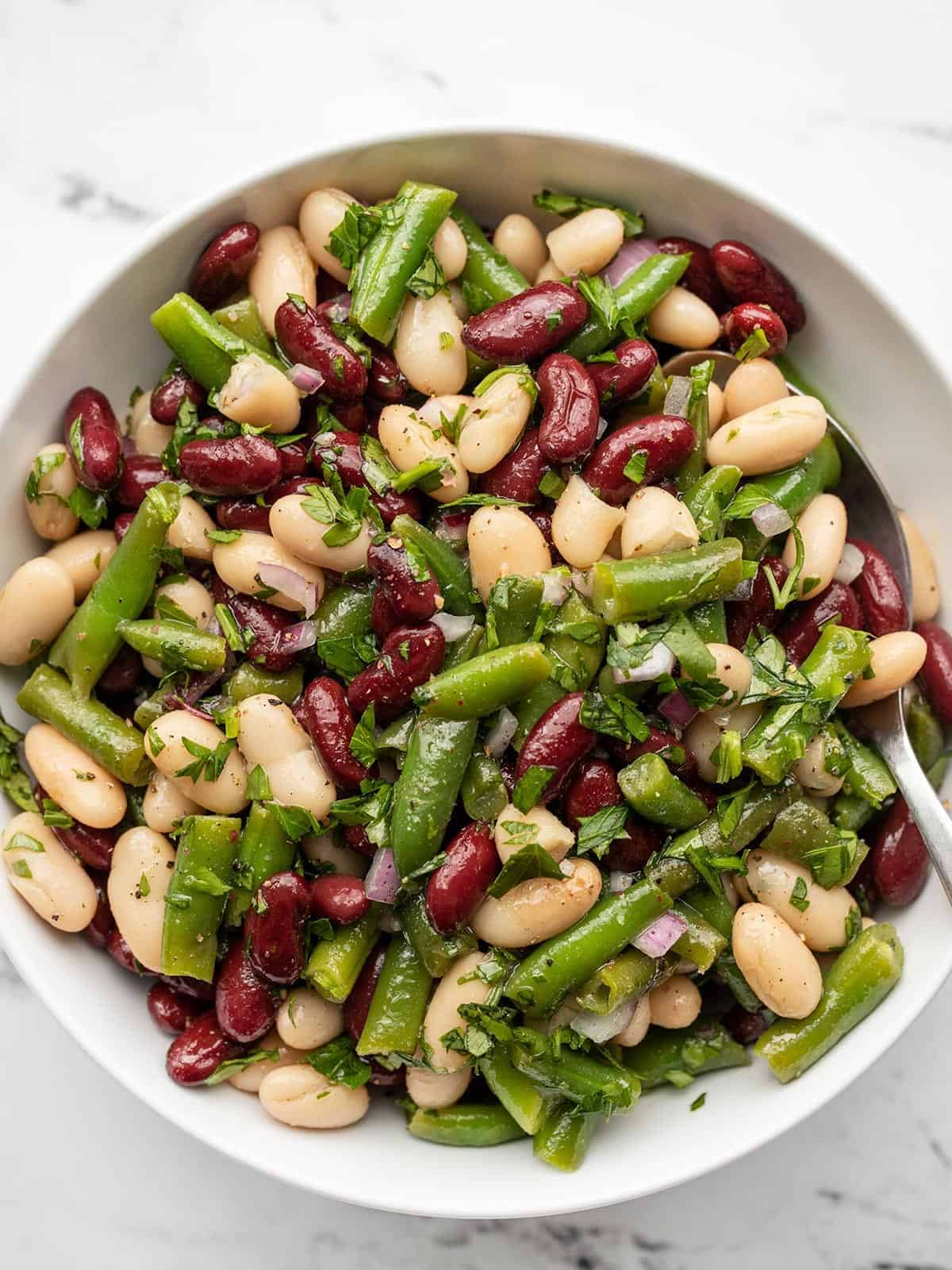 Overhead view of a bowl full of three bean salad