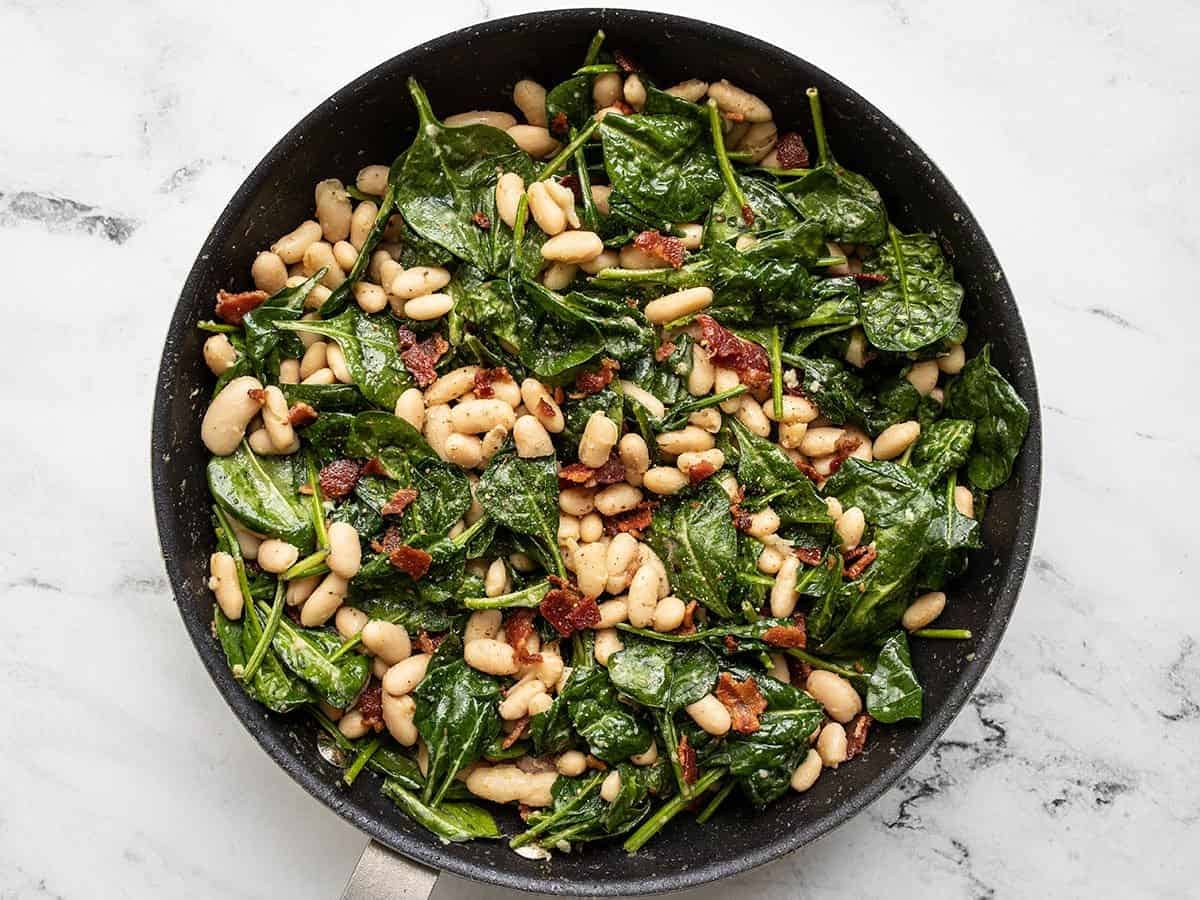 spinach and white beans topped with crumbled bacon.