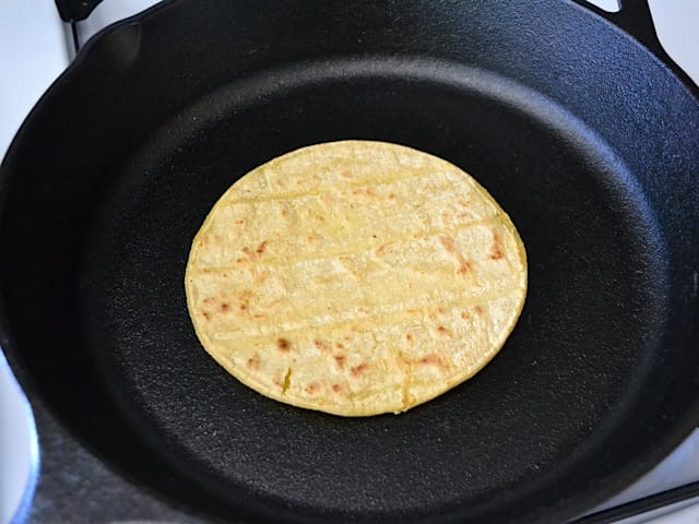 toasting tortilla in skillet 