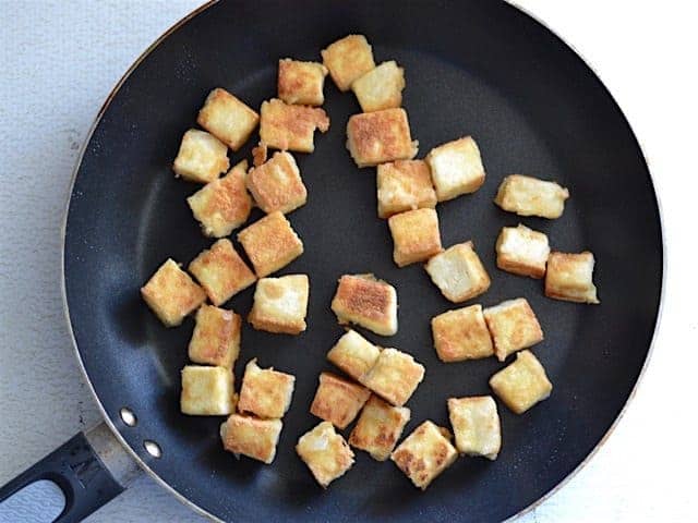 Fried cubed Tofu in a skillet