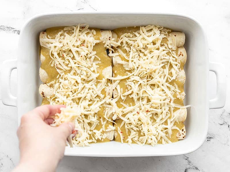 Top enchiladas with pepper jack cheese