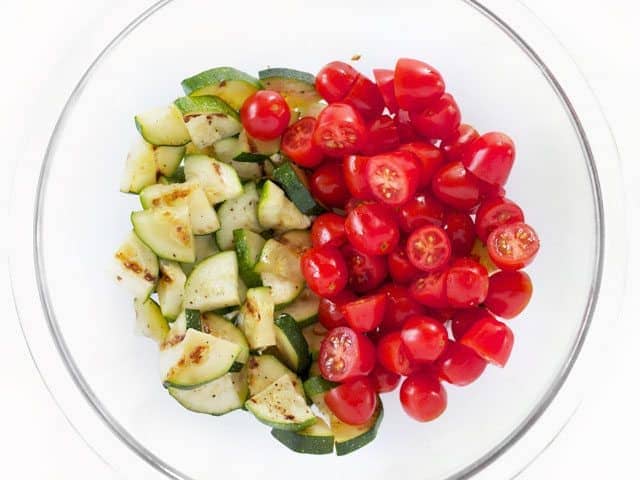 Chopped Zucchini and Tomato in a glass bowl