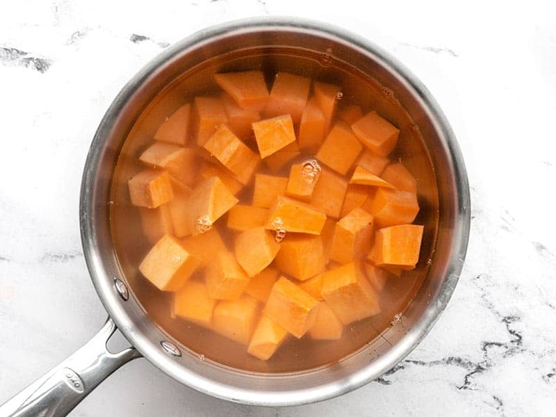 Diced sweet potato in a pot with water