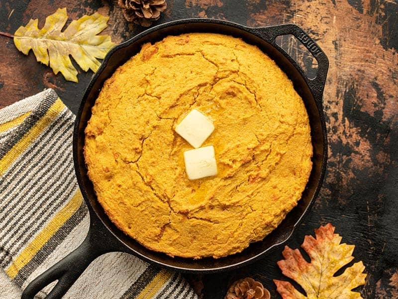 baked sweet potato cornbread with butter on top