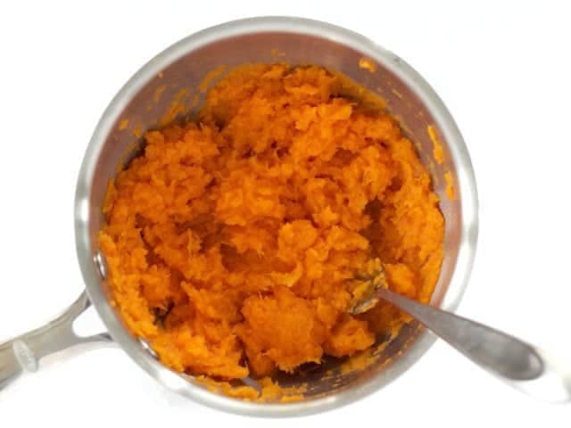 Mashed cooked Sweet Potatoes in pot 